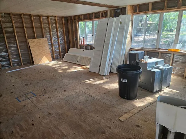 a view of a living room and a balcony