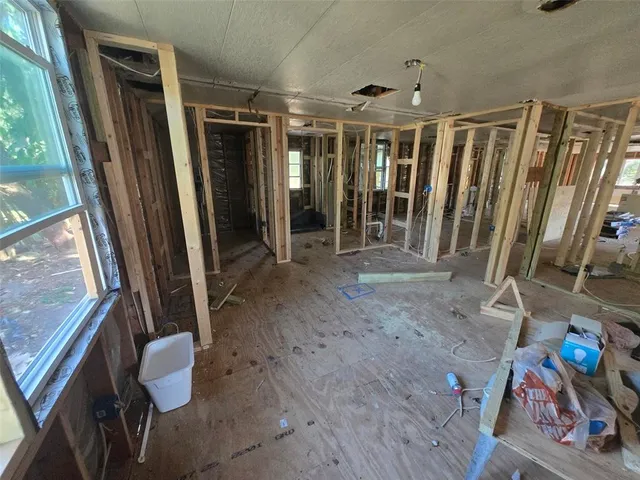 a view of an entryway with wooden floor