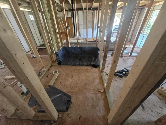 a view of living room with furniture and a fireplace