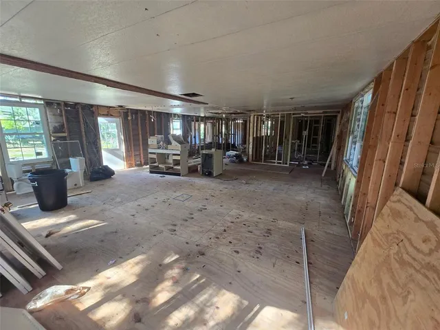 a view of a livingroom with couch and a window