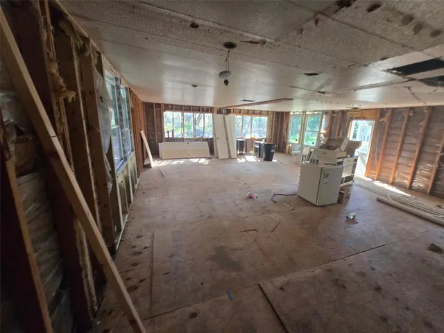 a view of a livingroom with furniture and windows