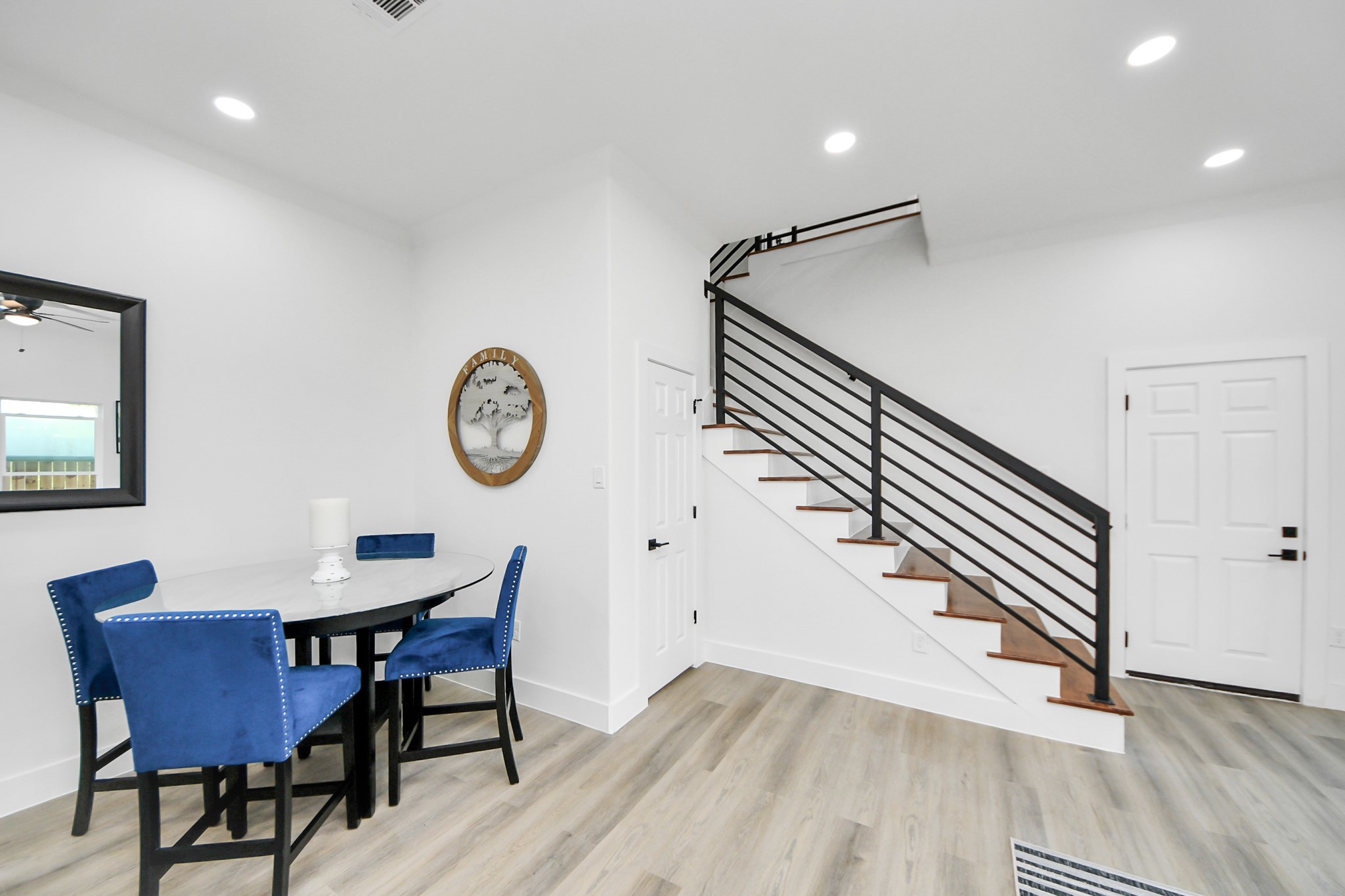 9305 Jutland Road Houston, TX 77033 - Photo 13 of 41 a view of a dining room with furniture and wooden floor