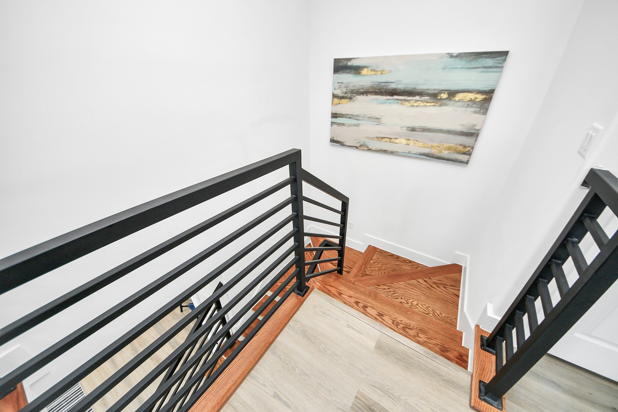 9305 Jutland Road Houston, TX 77033 - Photo 16 of 41 a view of a hallway with paintings on the wall