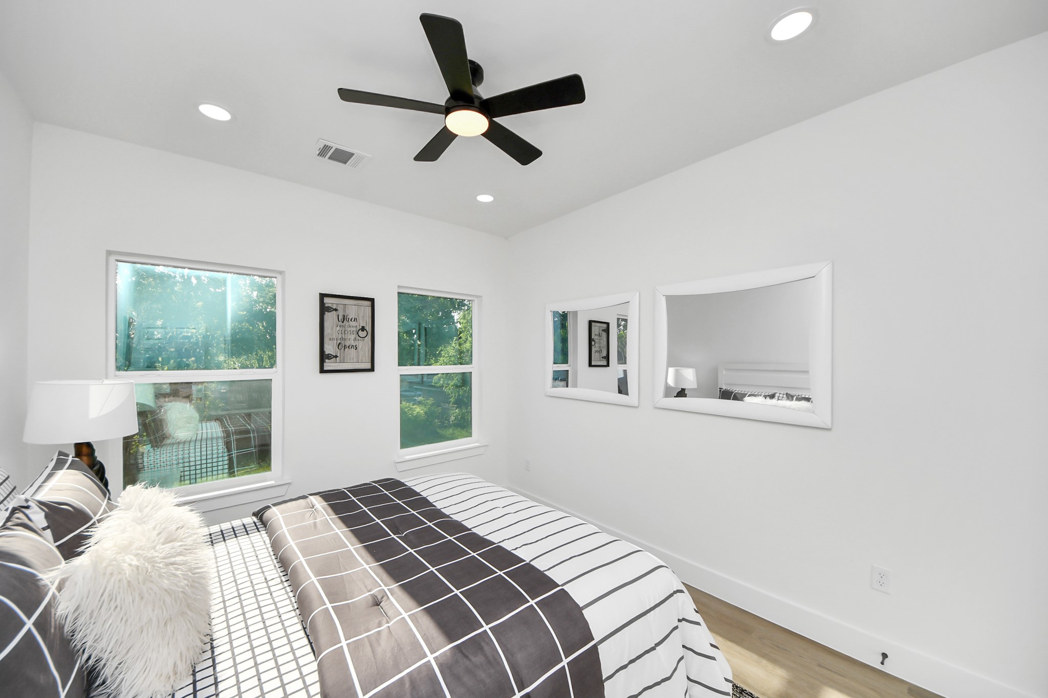 9305 Jutland Road Houston, TX 77033 - Photo 29 of 41 a bedroom with a large bed and a window