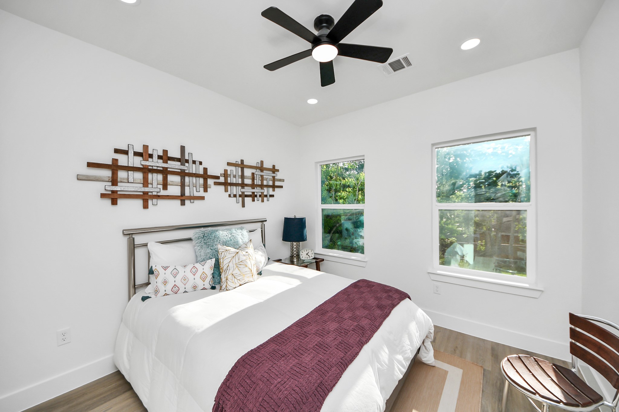 9305 Jutland Road Houston, TX 77033 - Photo 33 of 41 a bedroom with a bed and a large window