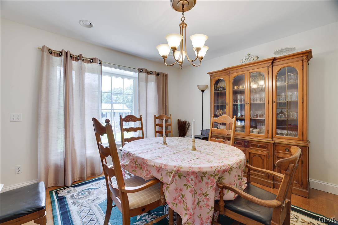 625 Buckle Boot Road Henryville, PA 18332 - Photo 13 of 40 a view of a dining room with furniture window and wooden floor
