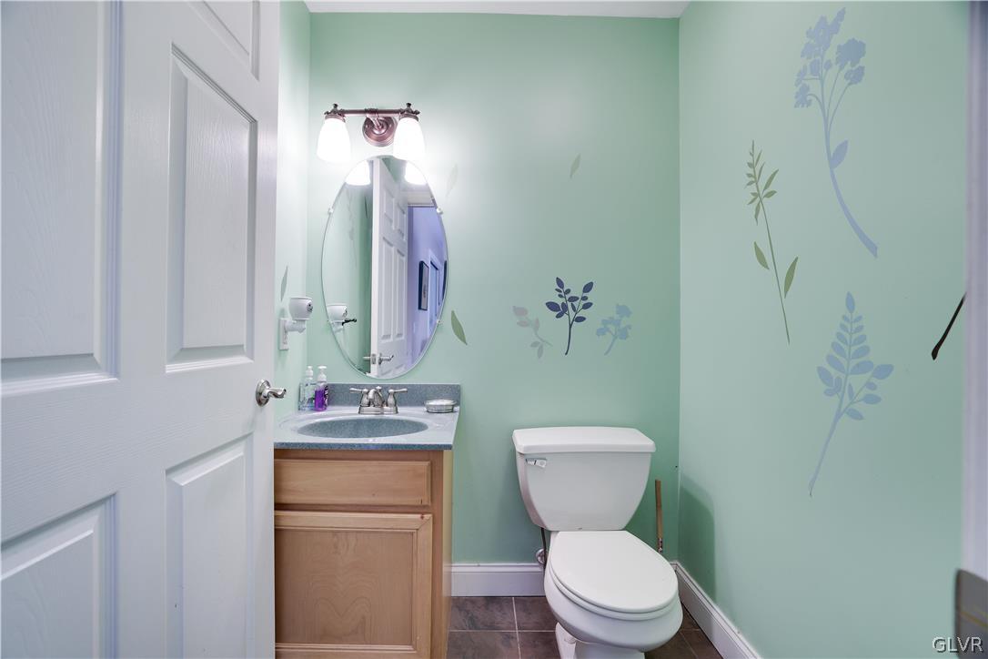 625 Buckle Boot Road Henryville, PA 18332 - Photo 14 of 40 a bathroom with a toilet sink and mirror