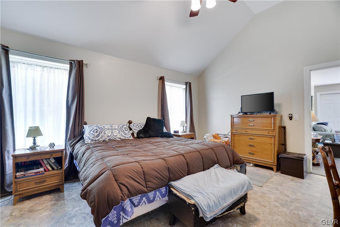 625 Buckle Boot Road Henryville, PA 18332 - Photo 16 of 40 a bedroom with a bed and flat screen tv