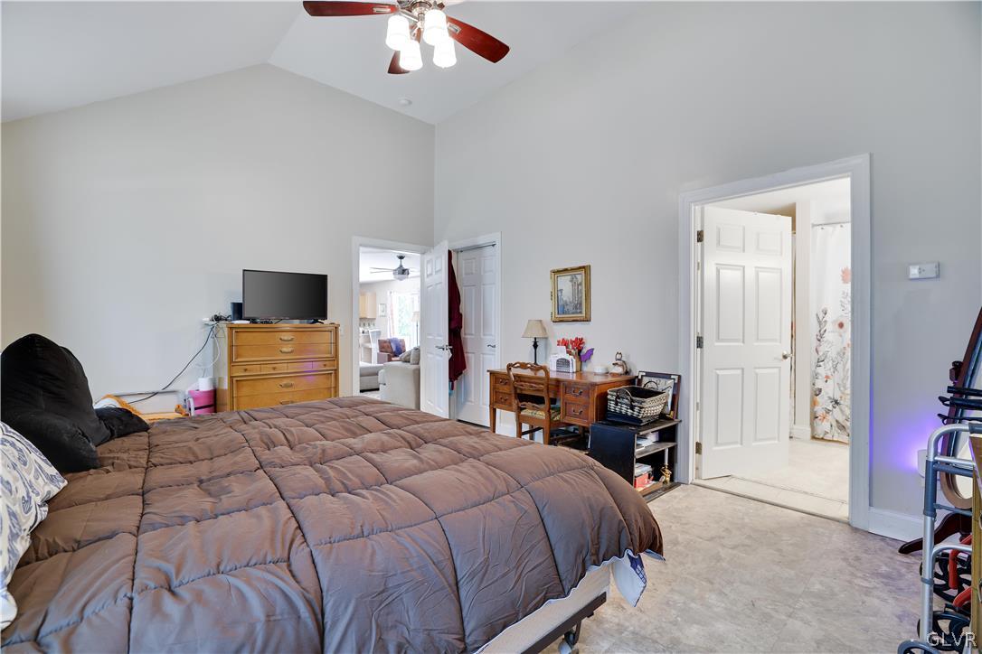 625 Buckle Boot Road Henryville, PA 18332 - Photo 17 of 40 a bedroom with a bed and a chandelier