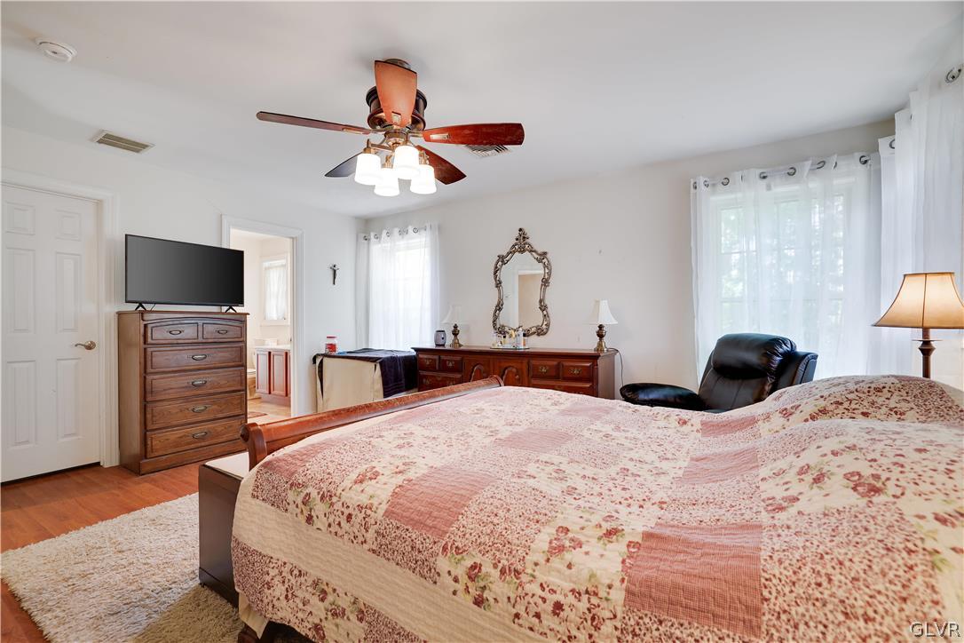 625 Buckle Boot Road Henryville, PA 18332 - Photo 24 of 40 a bedroom with a bed and a flat screen tv