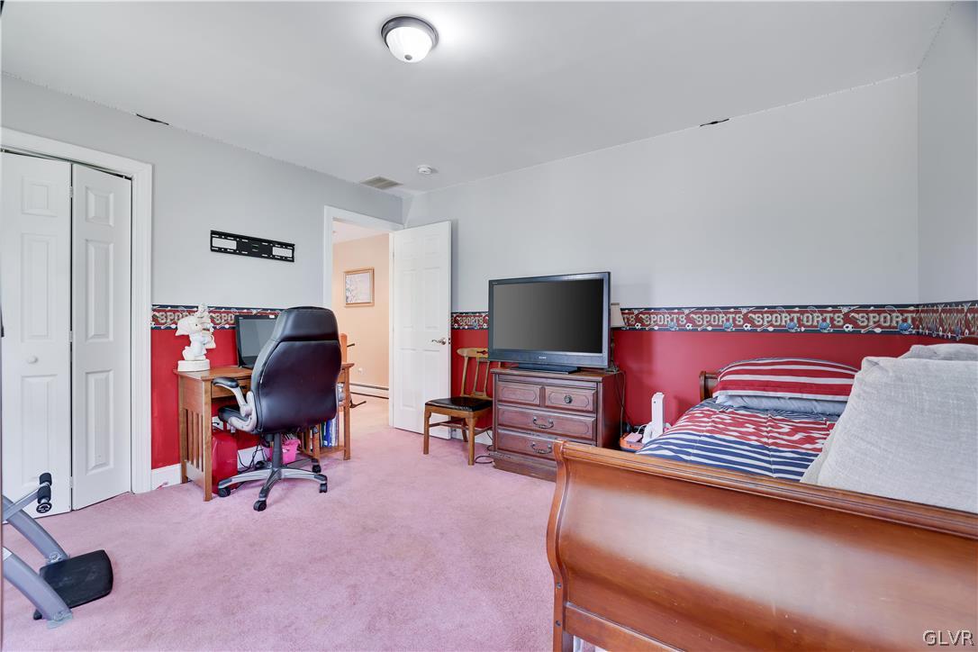 625 Buckle Boot Road Henryville, PA 18332 - Photo 29 of 40 a bedroom with furniture and a flat screen tv