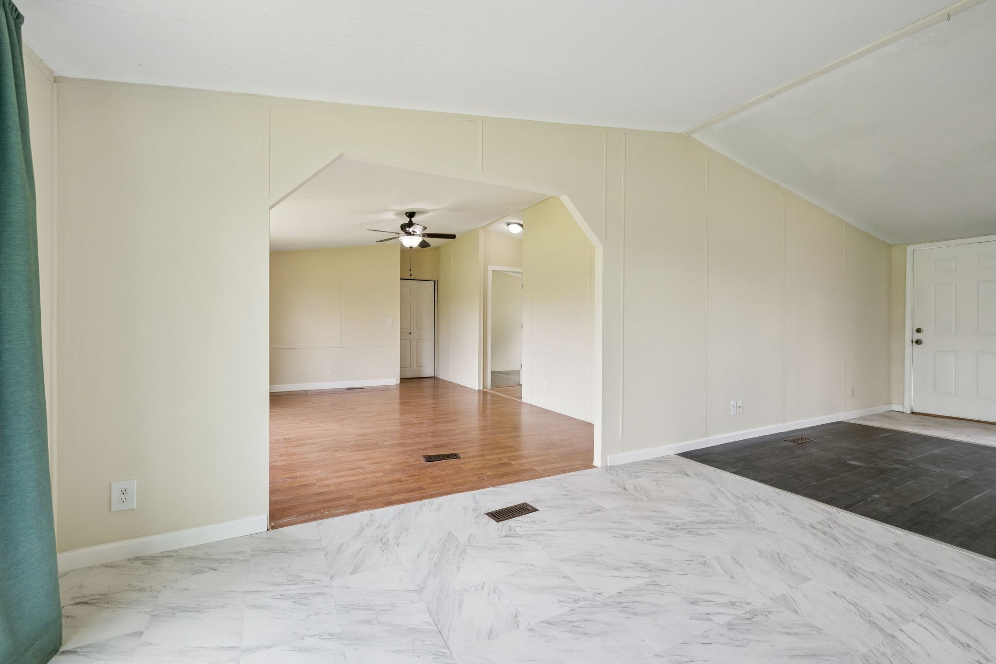 392 Martin Chapel Road Portland, TN 37148 - Photo 14 of 46 an empty room with wooden floor and windows