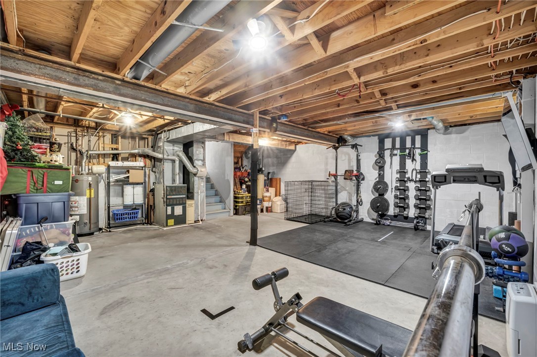18945 Thorpe Road Chagrin Falls, OH 44023 - Photo 30 of 35 Workout room featuring concrete flooring and water heater