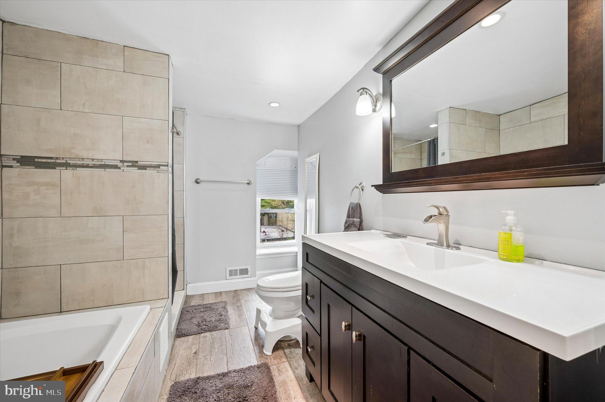 516 High Street Philadelphia, PA 19144 - Photo 13 of 31 Modern elegance in a serene bathroom.