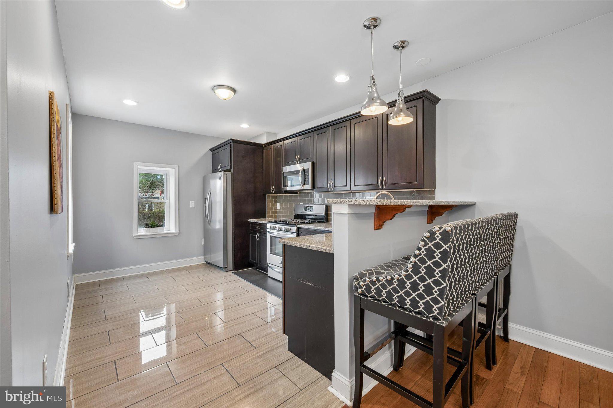 516 High Street Philadelphia, PA 19144 - Photo 8 of 31 Modern kitchen with sleek finishes.
