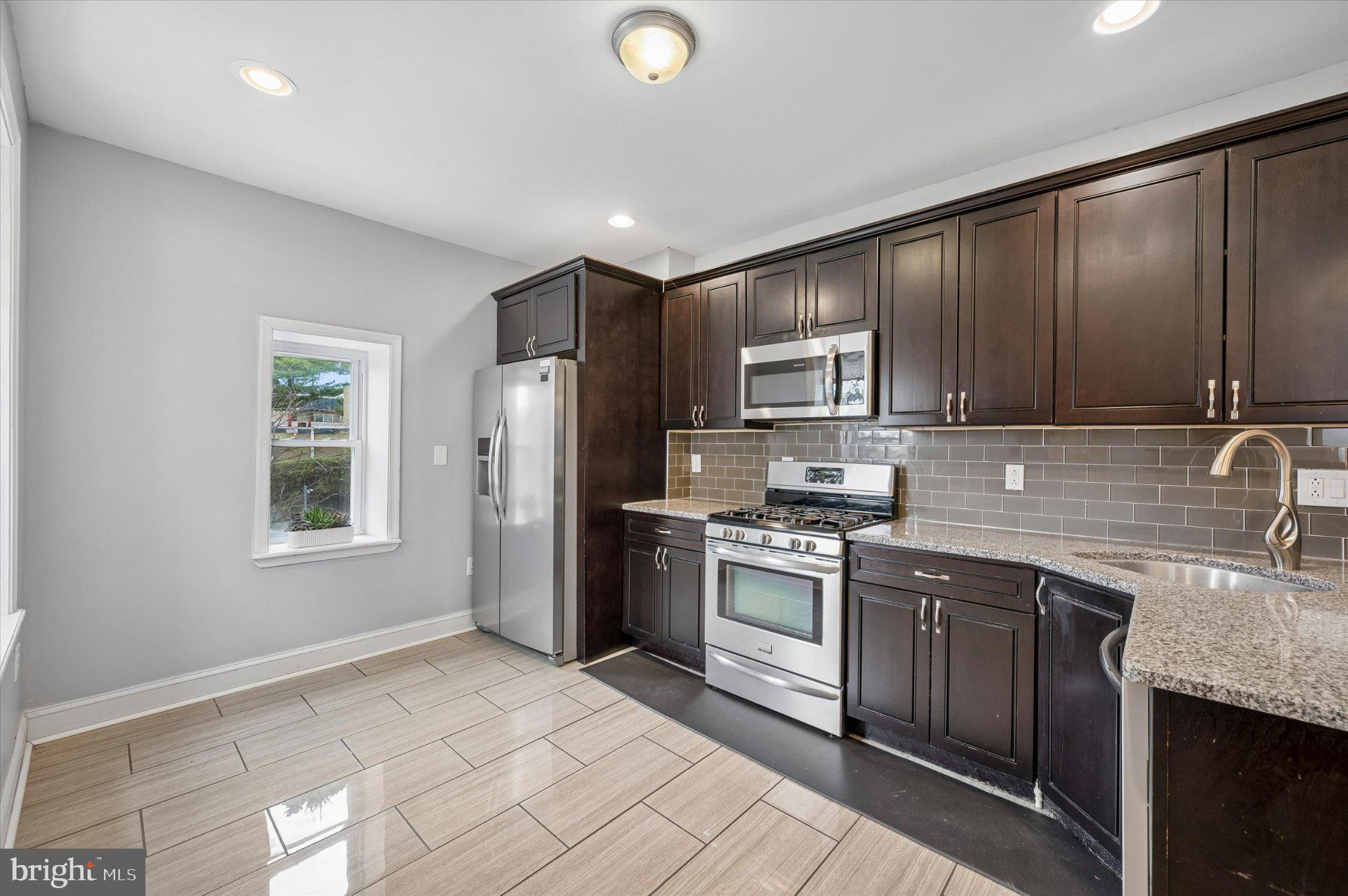 516 High Street Philadelphia, PA 19144 - Photo 9 of 31 Modern kitchen with sleek finishes.