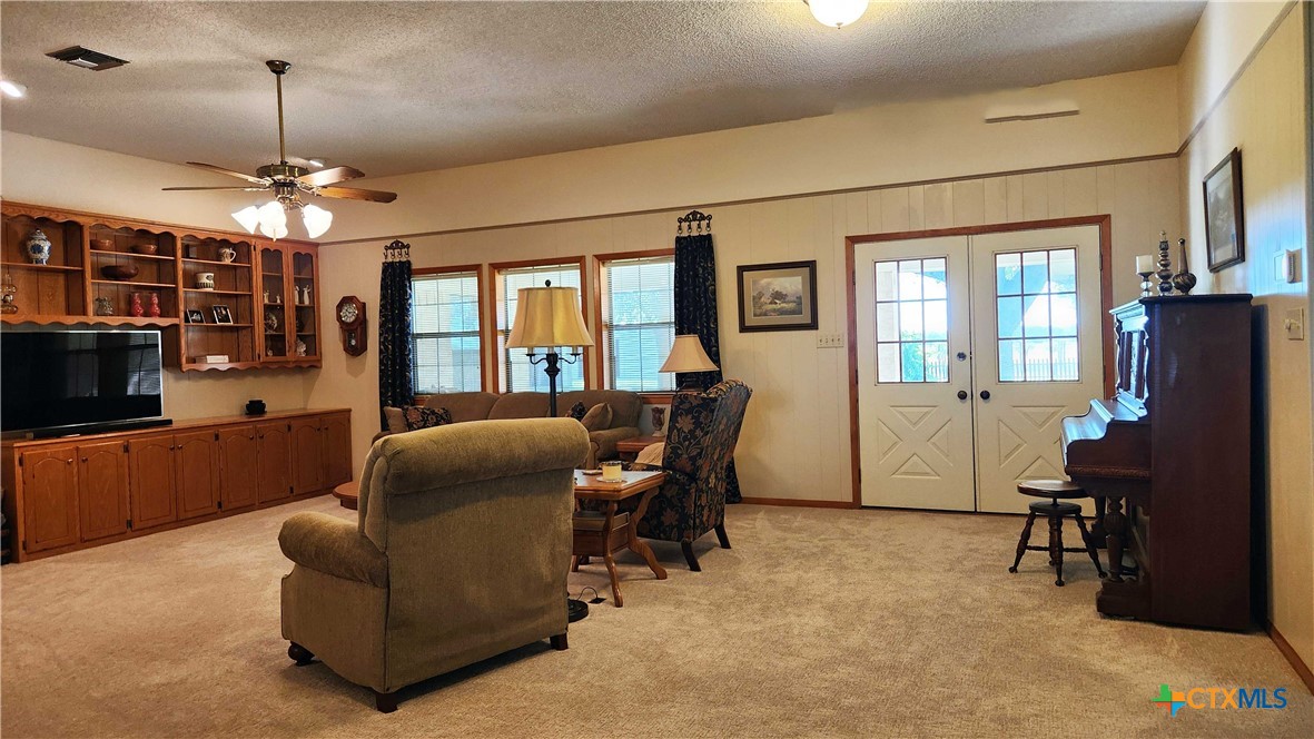 847 Oliver Road Victoria, TX 77904 - Photo 12 of 47 a living room with furniture and a flat screen tv