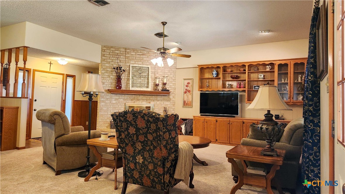 847 Oliver Road Victoria, TX 77904 - Photo 13 of 47 a living room with furniture and a flat screen tv