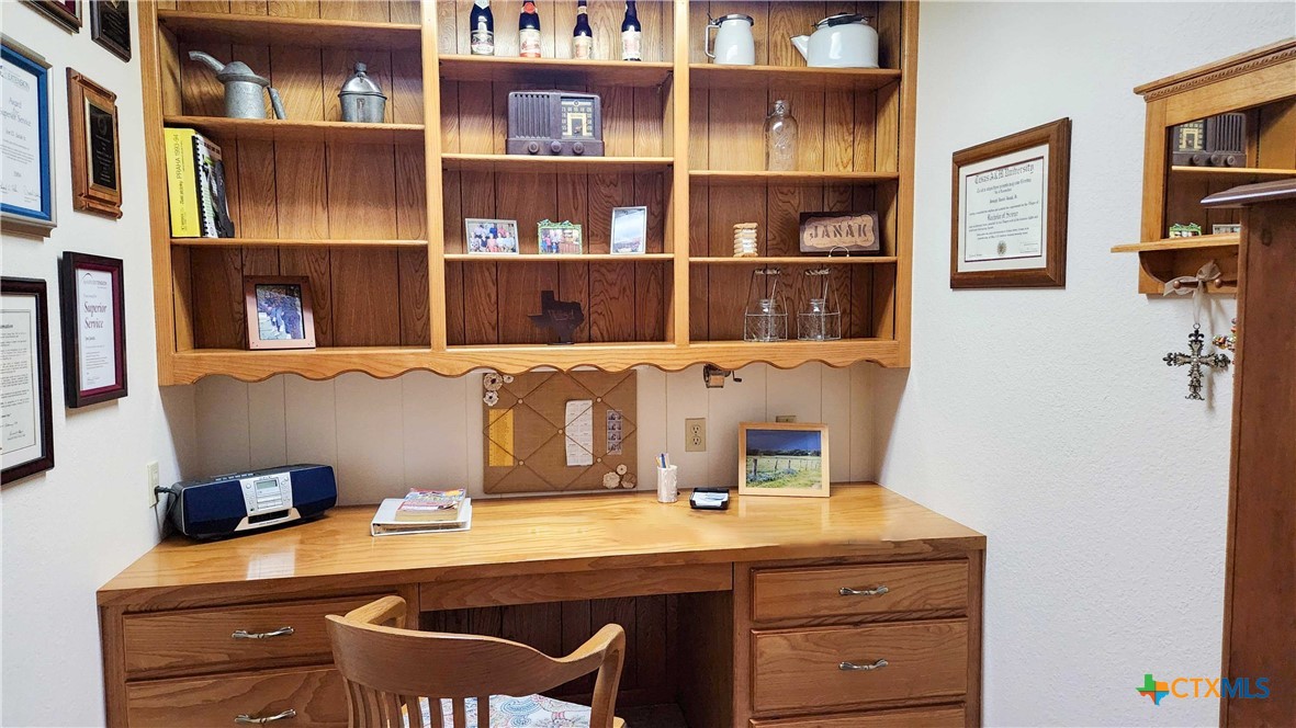 847 Oliver Road Victoria, TX 77904 - Photo 17 of 47 a room with a table and book shelf