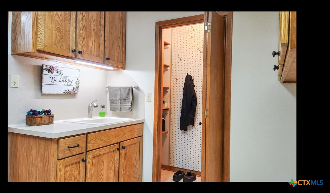 847 Oliver Road Victoria, TX 77904 - Photo 18 of 47 a kitchen with stainless steel appliances granite countertop a refrigerator and a sink