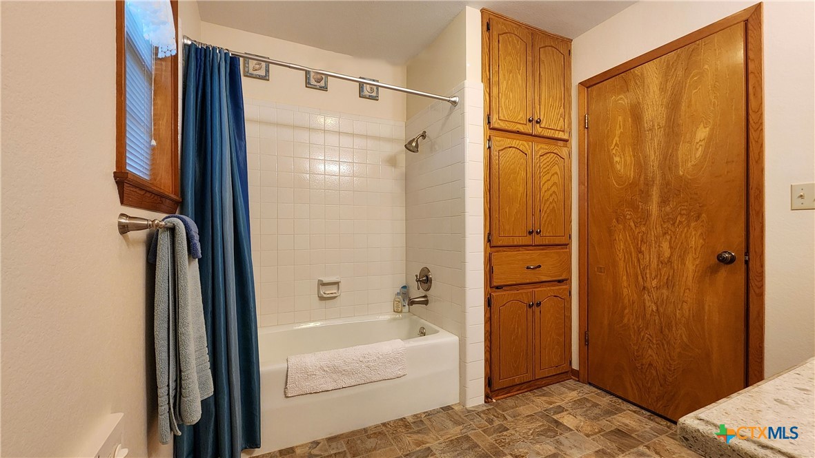 847 Oliver Road Victoria, TX 77904 - Photo 25 of 47 a bathroom with a shower and a tub