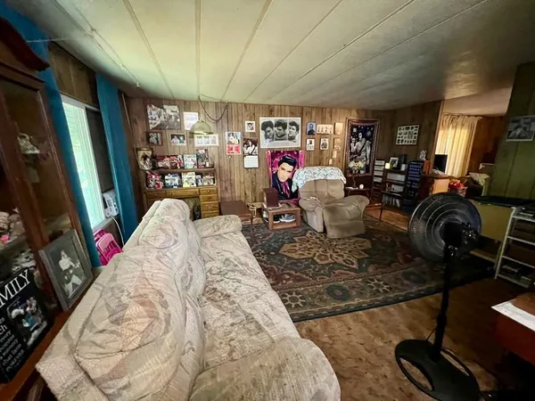 a bedroom with furniture and a window