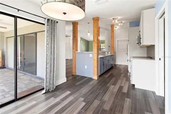 a kitchen with a refrigerator and a sink