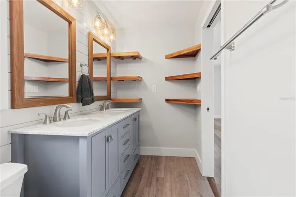 a bathroom with a sink and a mirror