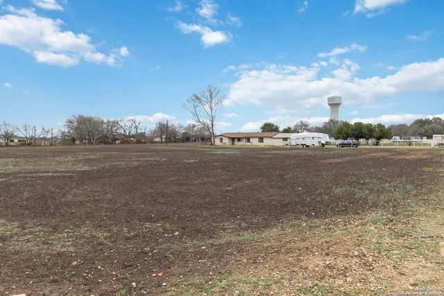 a view of a town with big trees