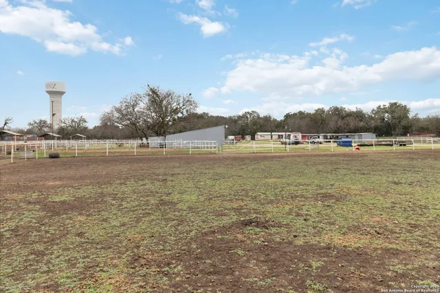 a view of a lake with houses in front of it