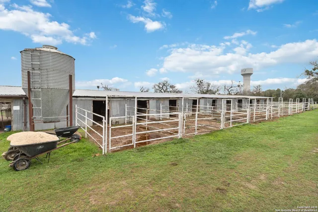 a view of a house with backyard and porch