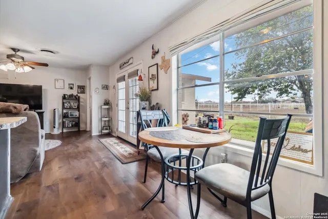 a living room with furniture and a rug