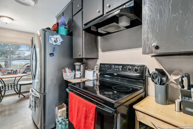 a kitchen with stainless steel appliances granite countertop lots of counter top space