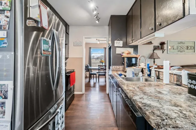 a living room with furniture a large window and a table