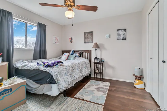 a bedroom with bed and window