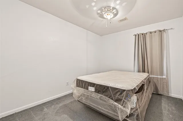 a bathroom with a bathtub and a toilet