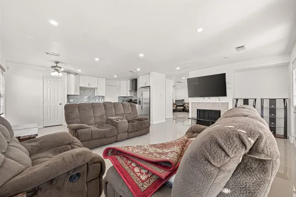 a white toilet sitting next to a bathroom sink