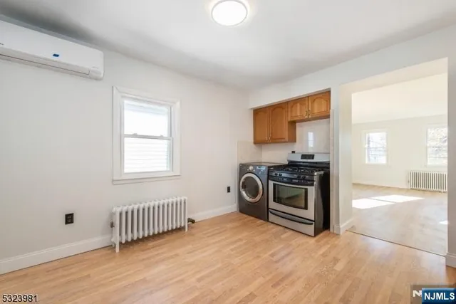 a view of a kitchen with a sink cabinets and a window