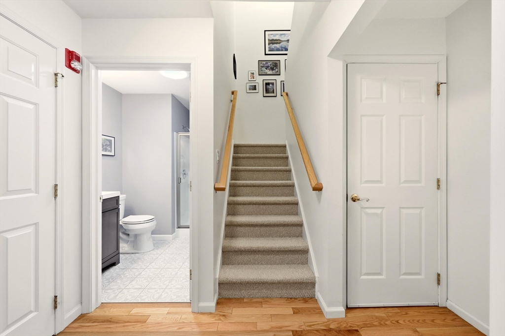 175 Leonard Street, Unit 2 Raynham, MA 02767 - Photo 12 of 27 a view of a bathroom from the hallway