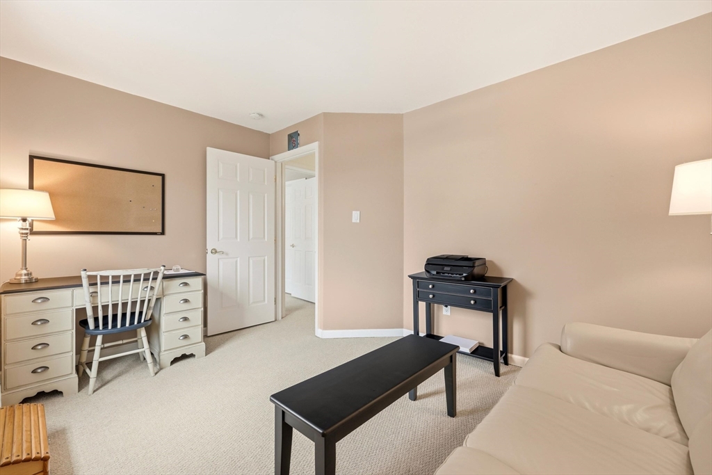 175 Leonard Street, Unit 2 Raynham, MA 02767 - Photo 22 of 27 a bedroom with furniture and a window