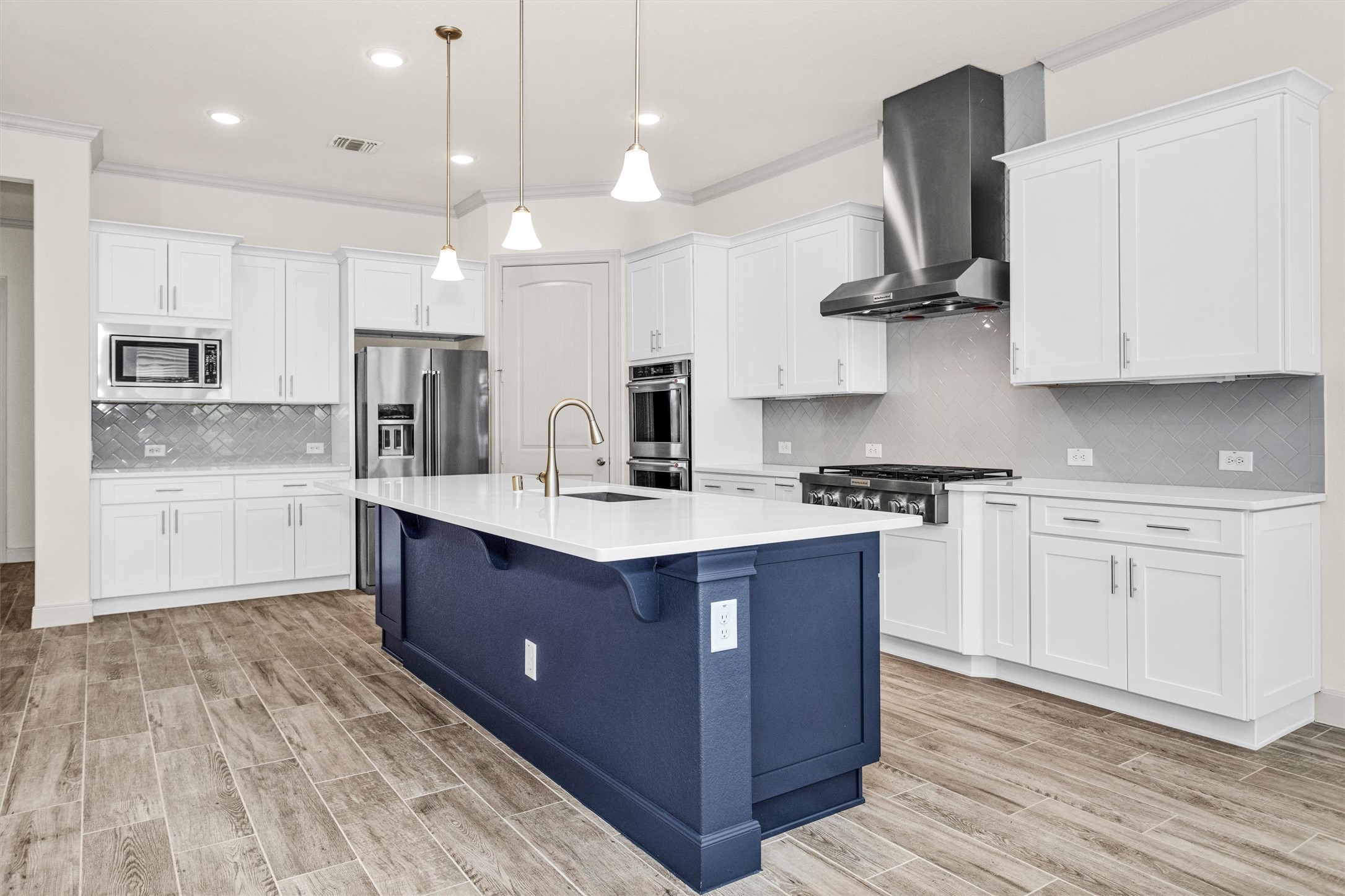 209 Fox Trotter Spring, TX 77382 - Photo 11 of 33 Elegant quartz countertops enhance the kitchen, complemented by versatile neutral tones for effortless decorating.