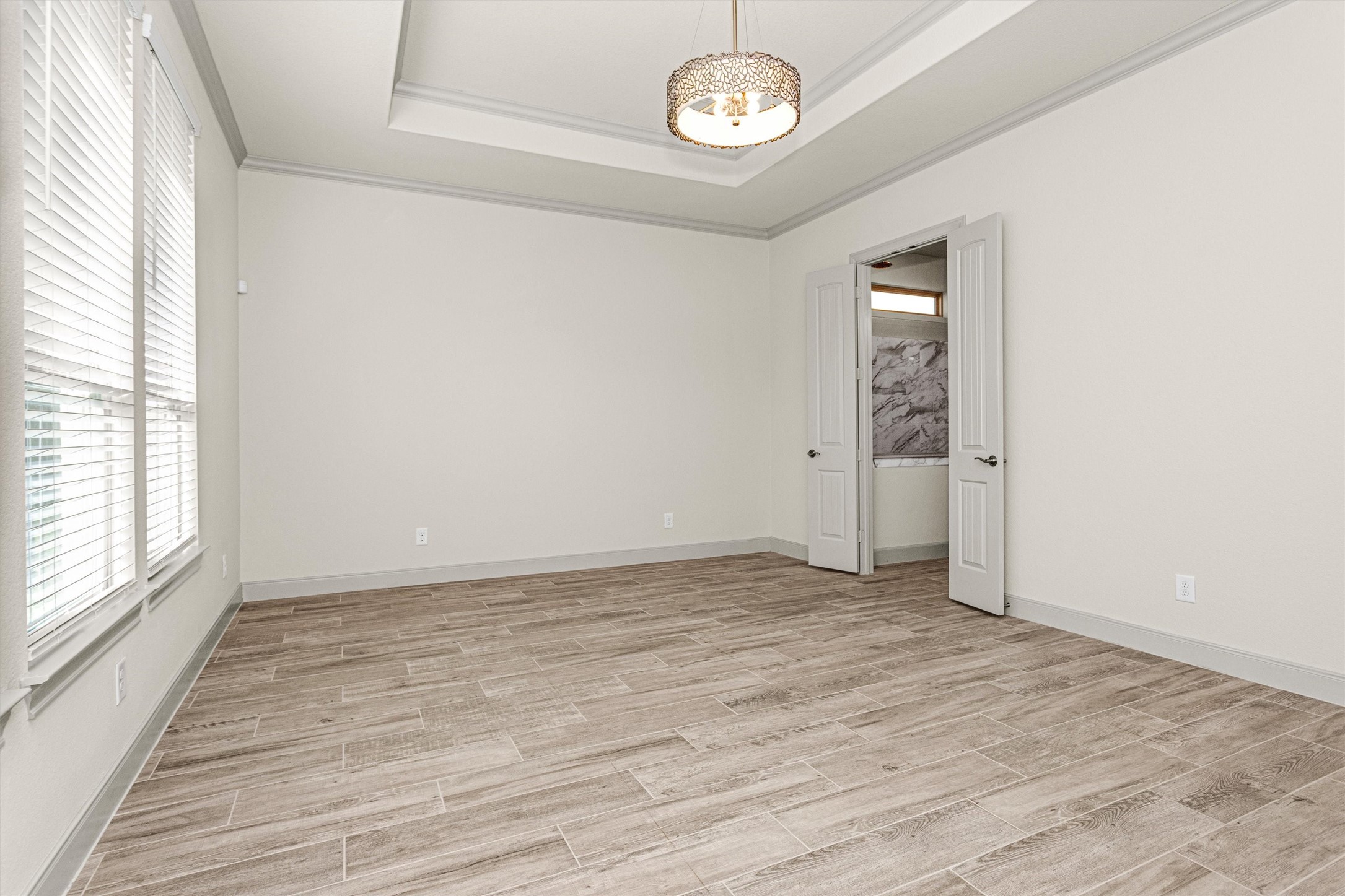 209 Fox Trotter Spring, TX 77382 - Photo 15 of 33 Here's a view of the expansive owner's suite with direct access to the elegant bathroom.