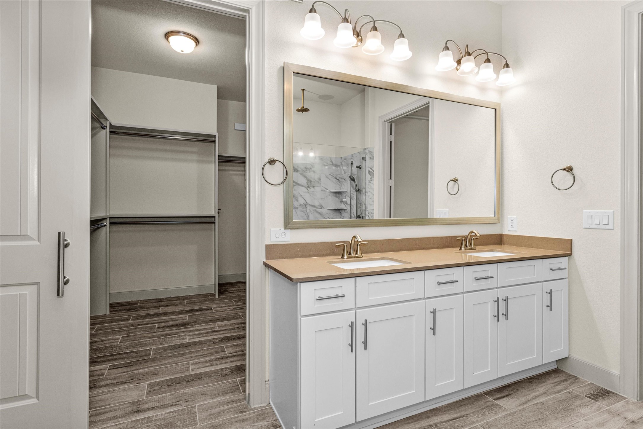 209 Fox Trotter Spring, TX 77382 - Photo 22 of 33 Luxurious owner's bath featuring dual vanities with elegant Moen Eva brushed nickel fixtures.