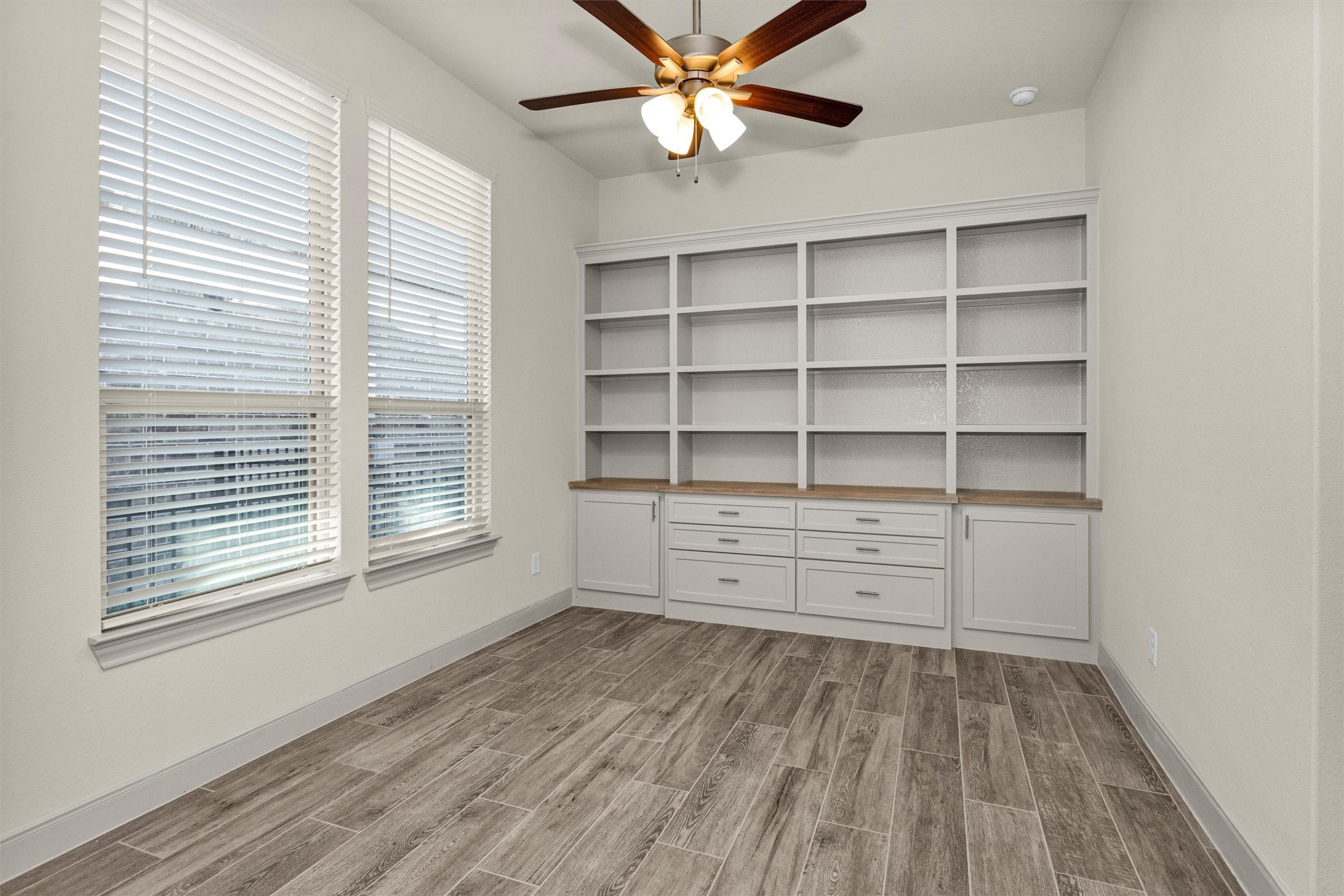 209 Fox Trotter Spring, TX 77382 - Photo 25 of 33 Experience tranquility in the Dual Owners Suite, featuring a custom built-in wall, perfect for relaxation and privacy.
