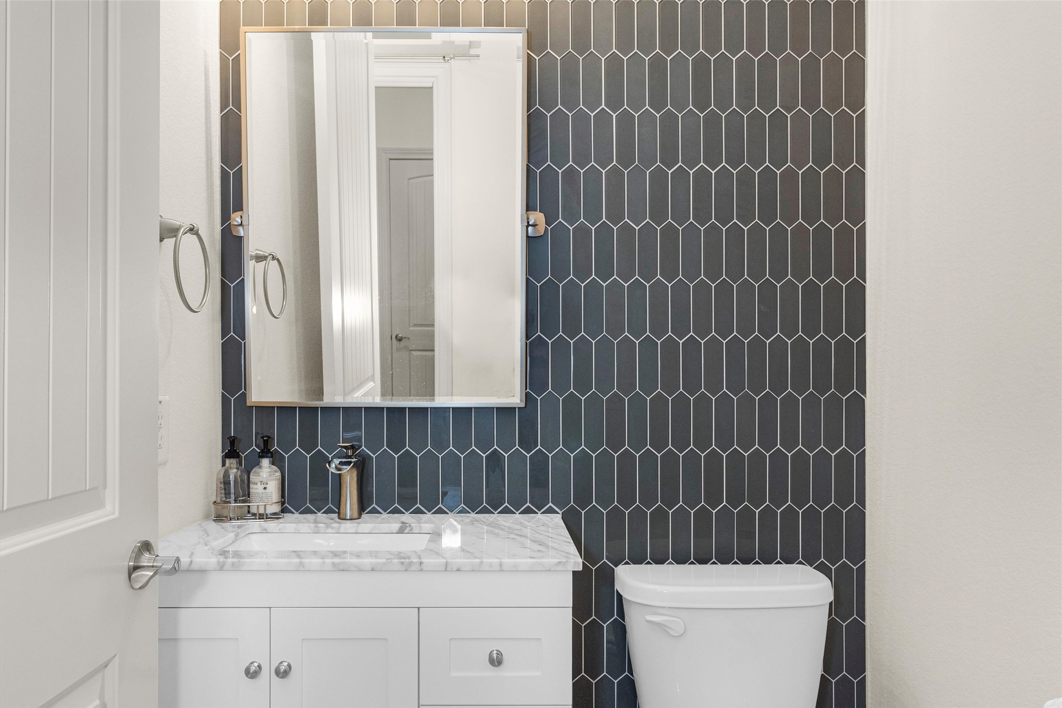 209 Fox Trotter Spring, TX 77382 - Photo 26 of 33 The powder bath showcases a stylish, custom design completed post-closing.