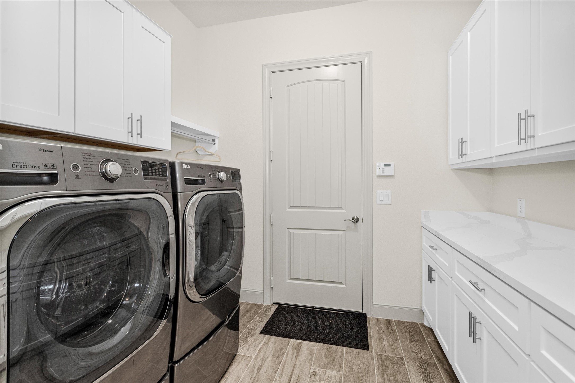 209 Fox Trotter Spring, TX 77382 - Photo 27 of 33 Expansive cabinetry enhances storage in the laundry room.