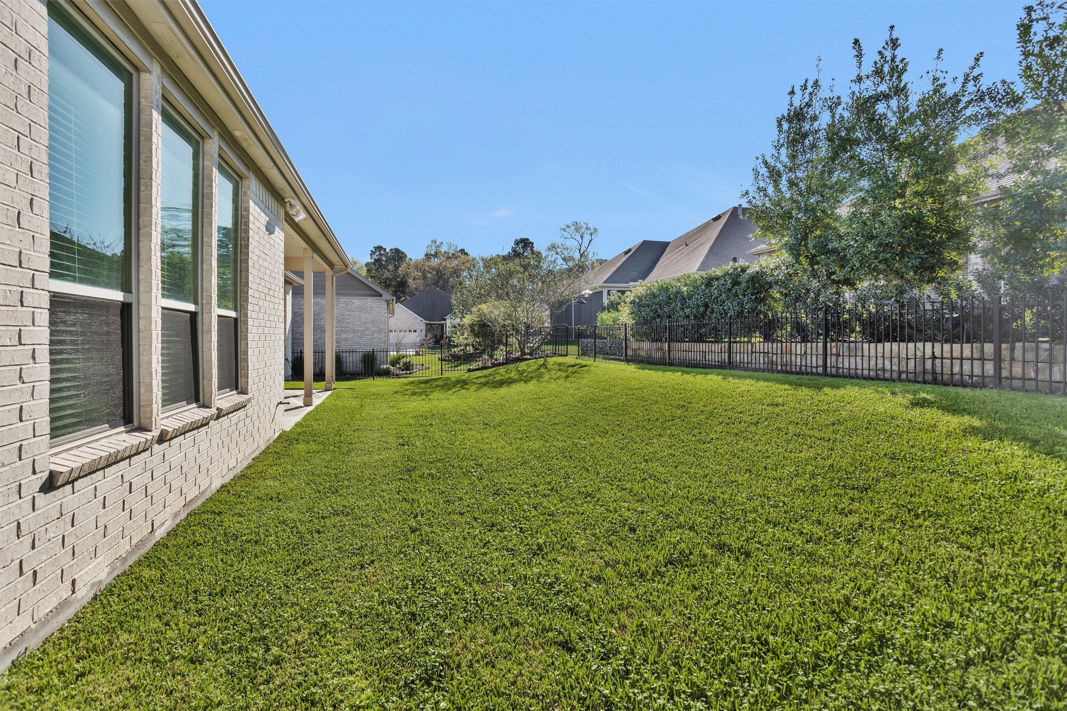 209 Fox Trotter Spring, TX 77382 - Photo 29 of 33 The spacious, fully fenced backyard is perfect for pets and family fun.