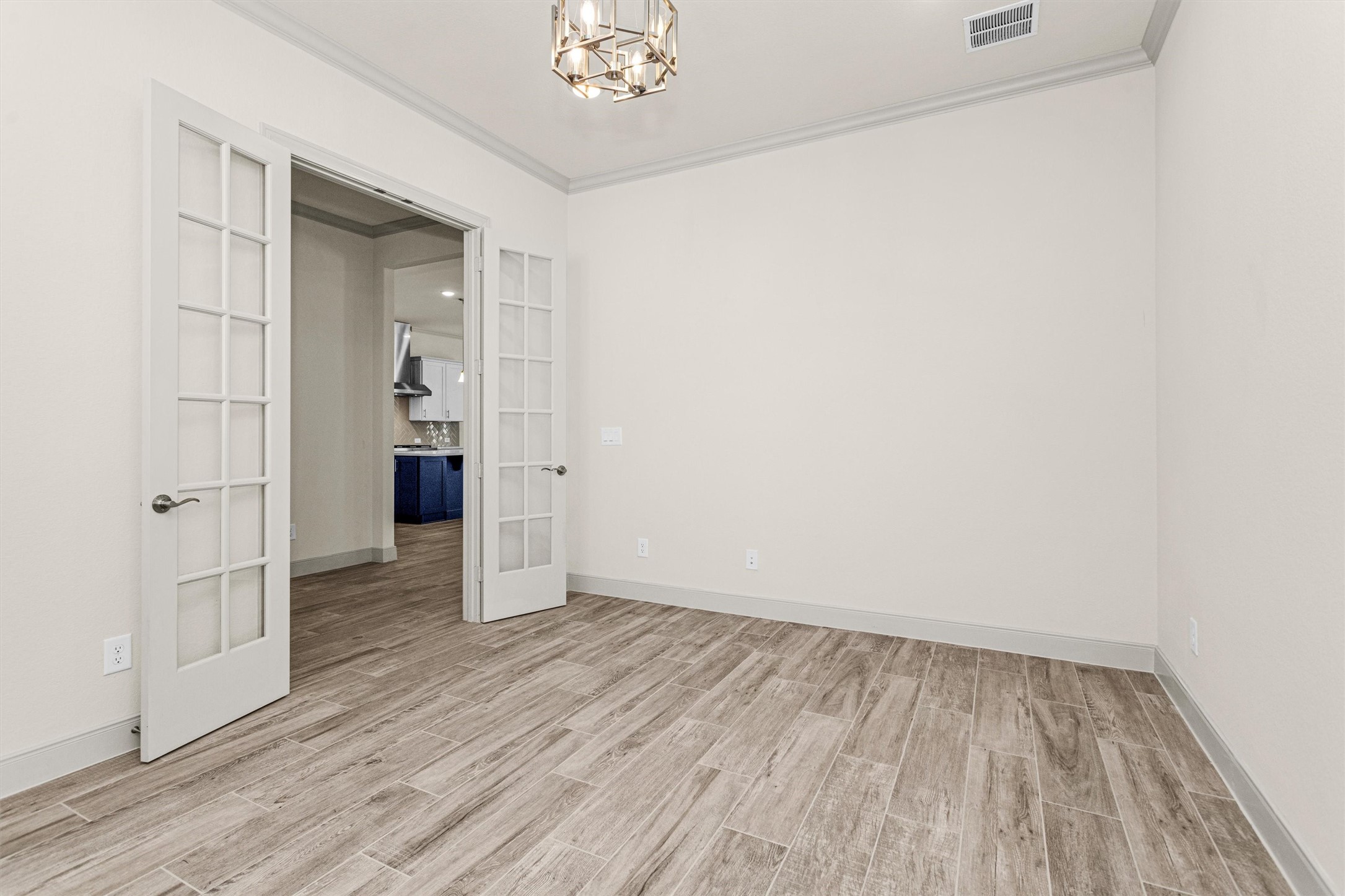 209 Fox Trotter Spring, TX 77382 - Photo 6 of 33 Experience the spacious study with stylish French doors for added privacy.