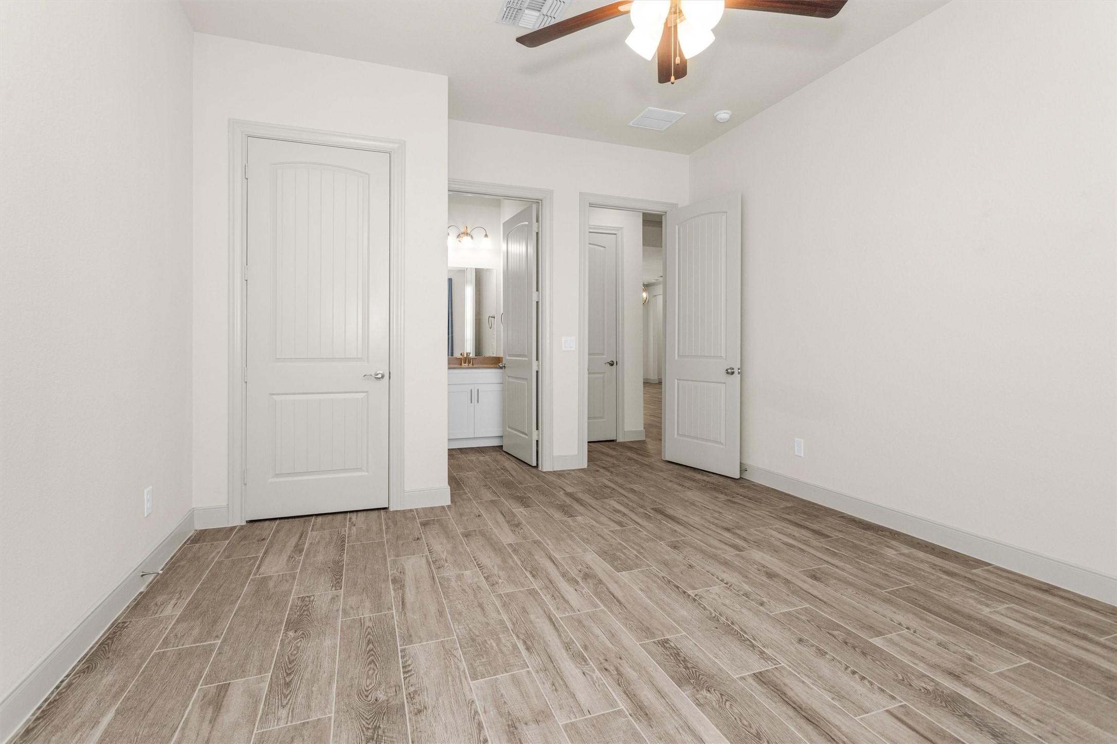 209 Fox Trotter Spring, TX 77382 - Photo 7 of 33 The guest bedroom is situated in a private wing, offering enhanced privacy for visitors.