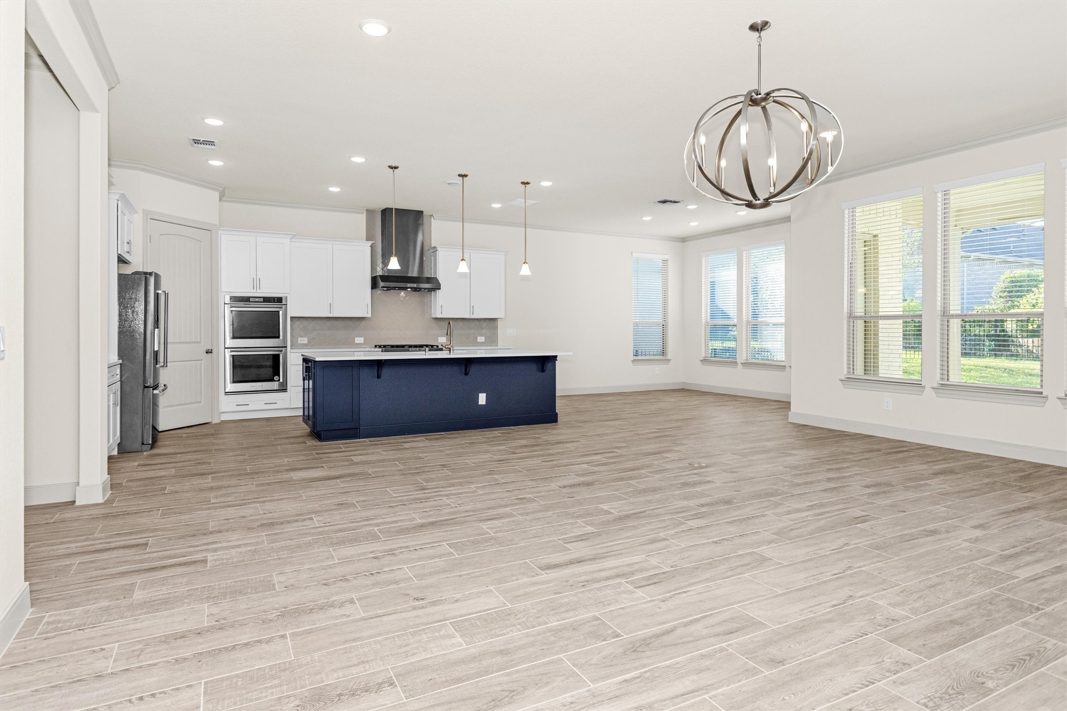 209 Fox Trotter Spring, TX 77382 - Photo 10 of 33 Experience culinary perfection in this open kitchen, boasting premium stainless-steel appliances and elegant 42" level 5 cabinets.